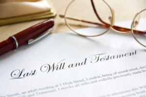 will lawyer Fort Collins, CO - last will and testament on desk with pen and glasses